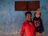 Father and daughter pose in front of the camera in Dhaka, Bangladesh, on August 29, 2020.  (