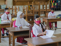 Students pay attention to the teacher at Candirejo Elementary School, Semarang Regency, Central Java, Indonesia, on September 1, 2020. Local...