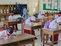 Students do their assignment at Candirejo Elementary School, Semarang Regency, Central Java, Indonesia, on September 1, 2020. Local governme...