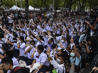 Thai students hold up a three finger salute as they protest against the government in front of the Ministry of Education, in Bangkok, Thaila...