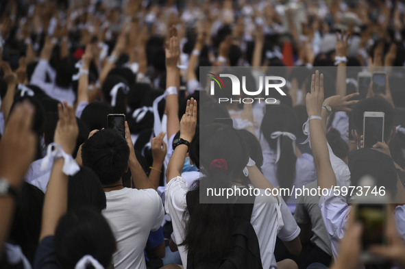 Thai students hold up a three finger salute as they protest against the government in front of the Ministry of Education, in Bangkok, Thaila...