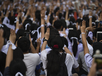 Thai students hold up a three finger salute as they protest against the government in front of the Ministry of Education, in Bangkok, Thaila...