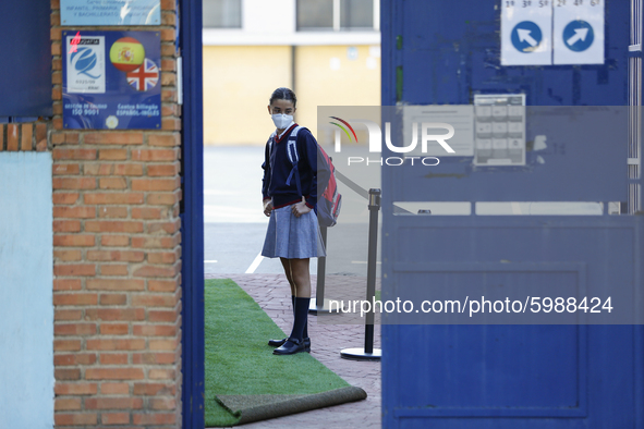 A girl with a facemask  entering to her education center during the first day of school on September 10, 2020 in Granada, Spain.  