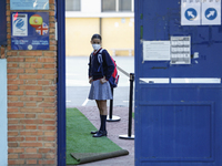 A girl with a facemask  entering to her education center during the first day of school on September 10, 2020 in Granada, Spain.  (