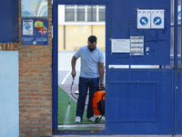 A worker with a facemask from an education center is disinfecting the floor during the first day of school on September 10, 2020 in Granada,...