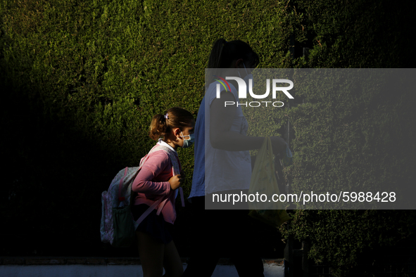 A girl with a facemask walking on the street during the first day of school on September 10, 2020 in Granada, Spain.  