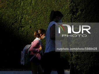 A girl with a facemask walking on the street during the first day of school on September 10, 2020 in Granada, Spain.  (