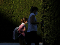 A girl with a facemask walking on the street during the first day of school on September 10, 2020 in Granada, Spain.  (