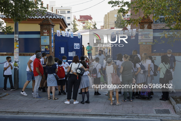 Many parents with their kids are waiting to enter to an education center during the first day of school on September 10, 2020 in Granada, Sp...