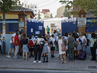 Many parents with their kids are waiting to enter to an education center during the first day of school on September 10, 2020 in Granada, Sp...