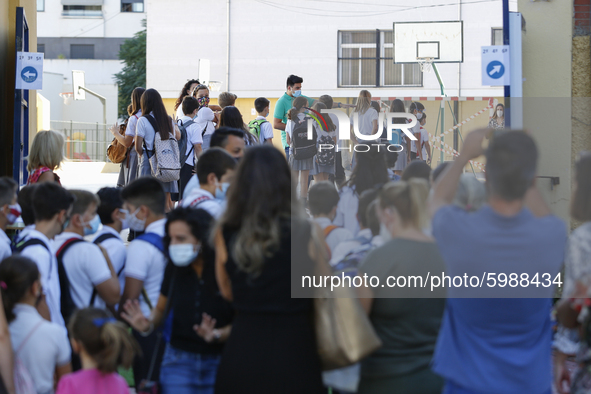 Many parents with their kids are waiting to enter to an education center during the first day of school on September 10, 2020 in Granada, Sp...