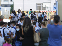 Many parents with their kids are waiting to enter to an education center during the first day of school on September 10, 2020 in Granada, Sp...