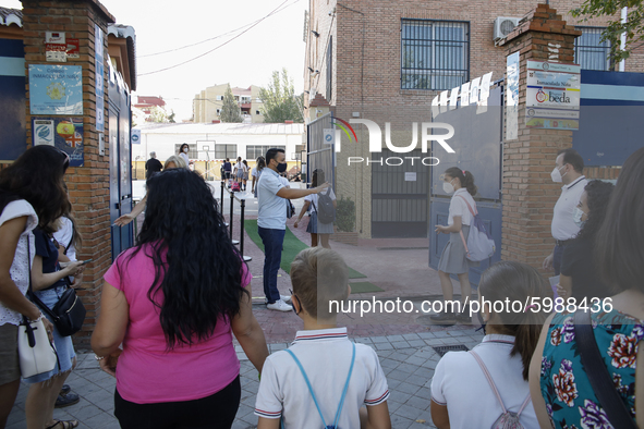 Many parents with their kids are waiting to enter to an education center during the first day of school on September 10, 2020 in Granada, Sp...