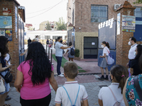 Many parents with their kids are waiting to enter to an education center during the first day of school on September 10, 2020 in Granada, Sp...