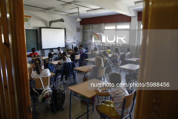 A teacher with a facemask teaching his students during the first day of school on September 10, 2020 in Granada, Spain.  