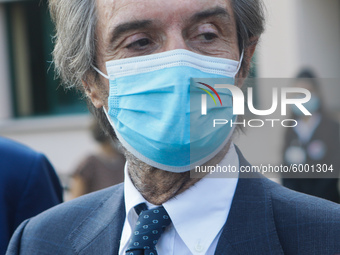 The President of Lombardy Region Attilio Fontana speaks to journalists during the visit to the Lagrange Institute in Milan during the reopen...