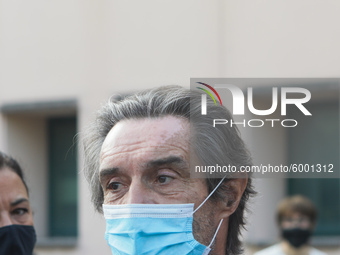 The President of Lombardy Region Attilio Fontana speaks to journalists during the visit to the Lagrange Institute in Milan during the reopen...