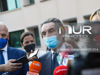 The President of Lombardy Region Attilio Fontana speaks to journalists during the visit to the Lagrange Institute in Milan during the reopen...