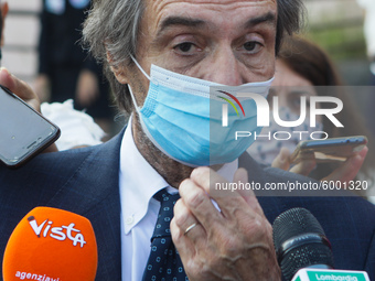 The President of Lombardy Region Attilio Fontana speaks to journalists during the visit to the Lagrange Institute in Milan during the reopen...