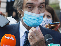 The President of Lombardy Region Attilio Fontana speaks to journalists during the visit to the Lagrange Institute in Milan during the reopen...