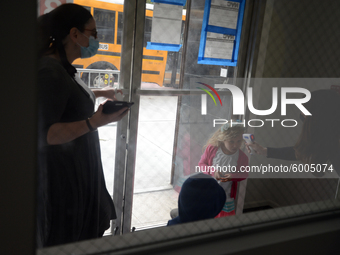 Students return for their first day of in-class schooling following the pandemic at New York City's Preschool of the Arts, having their temp...