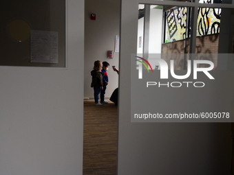 Students return for their first day of in-class schooling following the pandemic at New York City's Preschool of the Arts, having their temp...