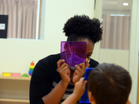 Masked students return for their first day of in-class schooling following the pandemic at New York City's Preschool of the Arts, with new c...