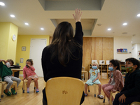 Masked students return for their first day of in-class schooling following the pandemic at New York City's Preschool of the Arts, with new c...