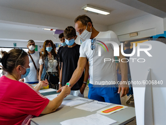 A collaborator measures the temperature of the students' parents to enter the Don Tonino Bello High School in Molfetta on 16th September 202...