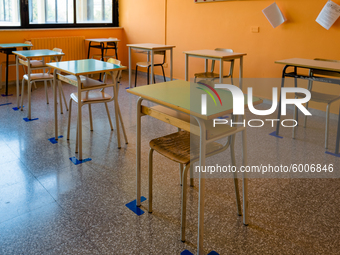 Detail of the desks of a school classroom with spacing and horizontal signs in the Don Tonino Bello High School in Molfetta on 16th Septembe...