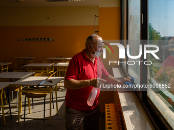 A janitor cleaning and disinfecting desks and the classroom in the Don Tonino Bello High School in Molfetta on 16th September 2020.
The reo...