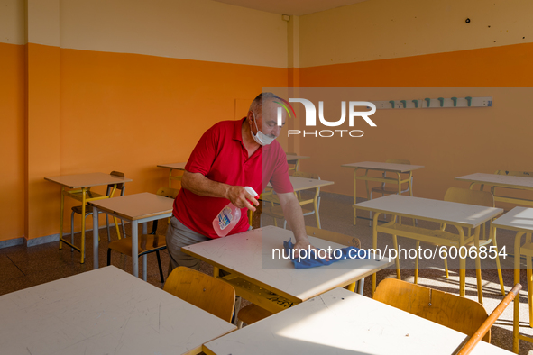 A janitor cleaning and disinfecting desks and the classroom in the Don Tonino Bello High School in Molfetta on 16th September 2020.
The reo...