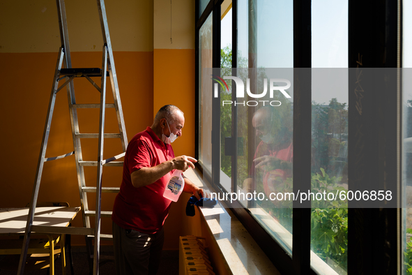 A janitor cleaning and disinfecting desks and the classroom in the Don Tonino Bello High School in Molfetta on 16th September 2020.
The reo...