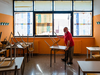 A janitor preparing the classroom with the spacing of the desks in the Don Tonino Bello High School in Molfetta on 16th September 2020.
The...