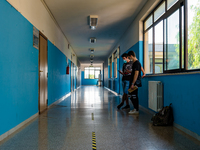 Students talking in the corridor with horizontal signs for distancing in the Don Tonino Bello High School in Molfetta on 16th September 2020...