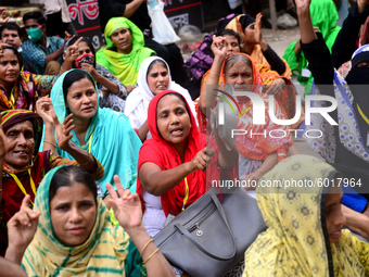 Garments workers of Dragon Group stage a demonstration in front of Department of Labor building demanding their due payment in Dhaka, Bangla...