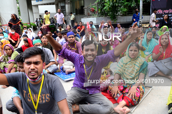 Garments workers of Dragon Group stage a demonstration in front of Department of Labor building demanding their due payment in Dhaka, Bangla...