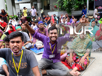 Garments workers of Dragon Group stage a demonstration in front of Department of Labor building demanding their due payment in Dhaka, Bangla...