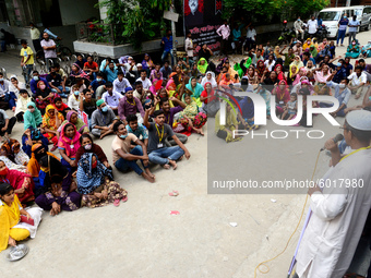 Garments workers of Dragon Group stage a demonstration in front of Department of Labor building demanding their due payment in Dhaka, Bangla...