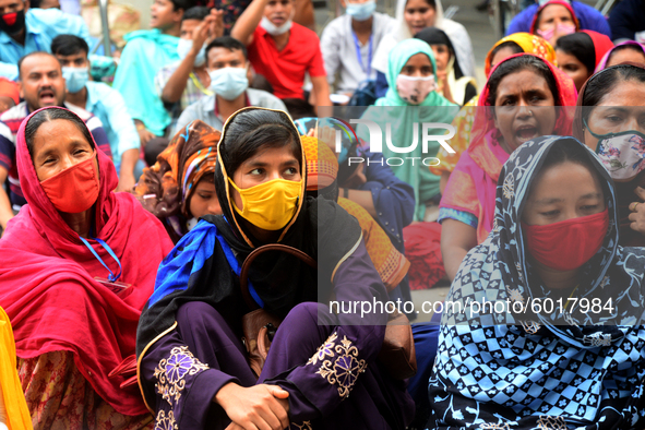 Garments workers of Dragon Group stage a demonstration in front of Department of Labor building demanding their due payment in Dhaka, Bangla...