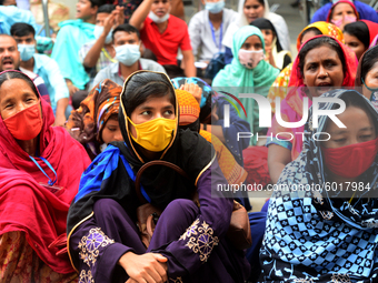 Garments workers of Dragon Group stage a demonstration in front of Department of Labor building demanding their due payment in Dhaka, Bangla...