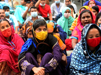 Garments workers of Dragon Group stage a demonstration in front of Department of Labor building demanding their due payment in Dhaka, Bangla...