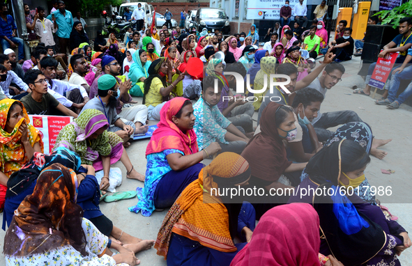 Garments workers of Dragon Group stage a demonstration in front of Department of Labor building demanding their due payment in Dhaka, Bangla...