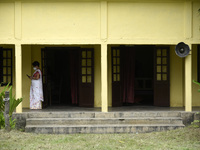 A teacher arrives  at a school, in Guwahati, Assam, India on September 21, 2020 as schools reopened after more than 5-months closure due to...