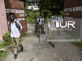 Students coming out from a school after attend school, in Guwahati, Assam, India on September 21, 2020 as schools reopened after more than 5...