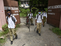 Students coming out from a school after attend school, in Guwahati, Assam, India on September 21, 2020 as schools reopened after more than 5...