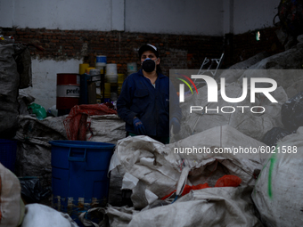 A woman carries out the process of separating materials in a recycling warehouse in the Las Cruces neighborhood in Bogota, Colombia on Septe...