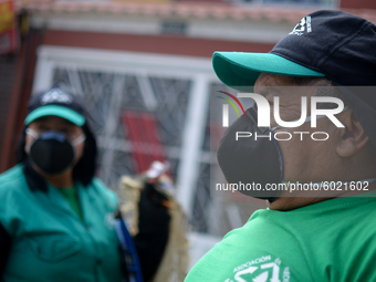 Mr. Botache and Mrs. Stella, during a work day on the recycling route in the town of San Cristóbal, in Bogota, Colombia on September 9, 2020...