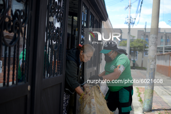 Mr. Botache belongs to the group of Environmental Recuperators walks through the streets of the town of San Cristobal on a collection day in...