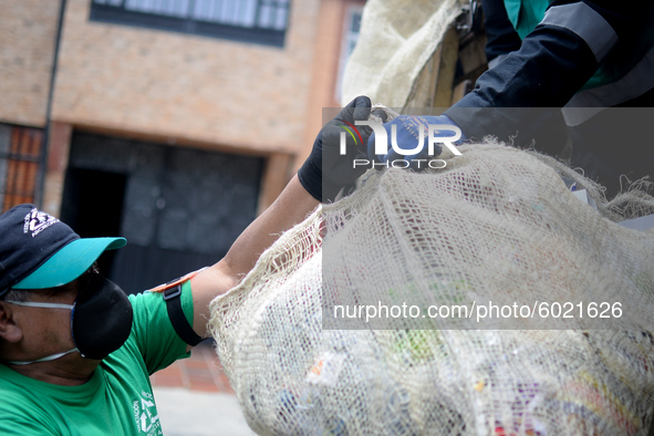 A worker loads the recycled material into the truck during a working day in the town of San Cristóbal, in Bogota, Colombia on September 9, 2...